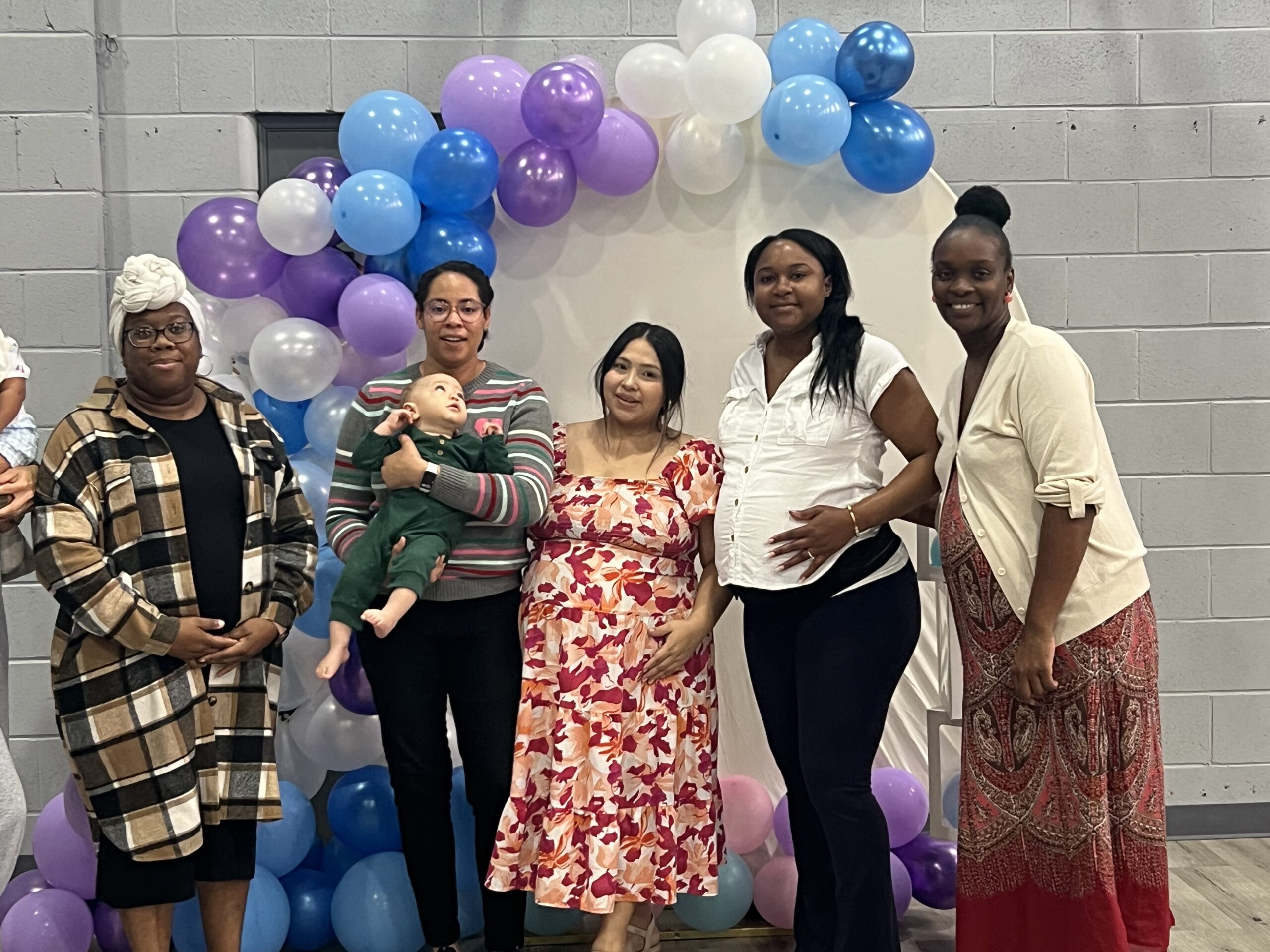 Mothers and children participating in a Radiant Mom Academy community gathering